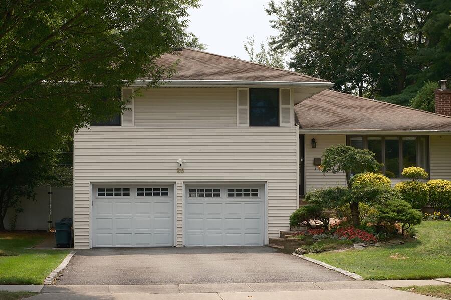 The double garage door of a Natomas tract house, with the slab edge at the apron
