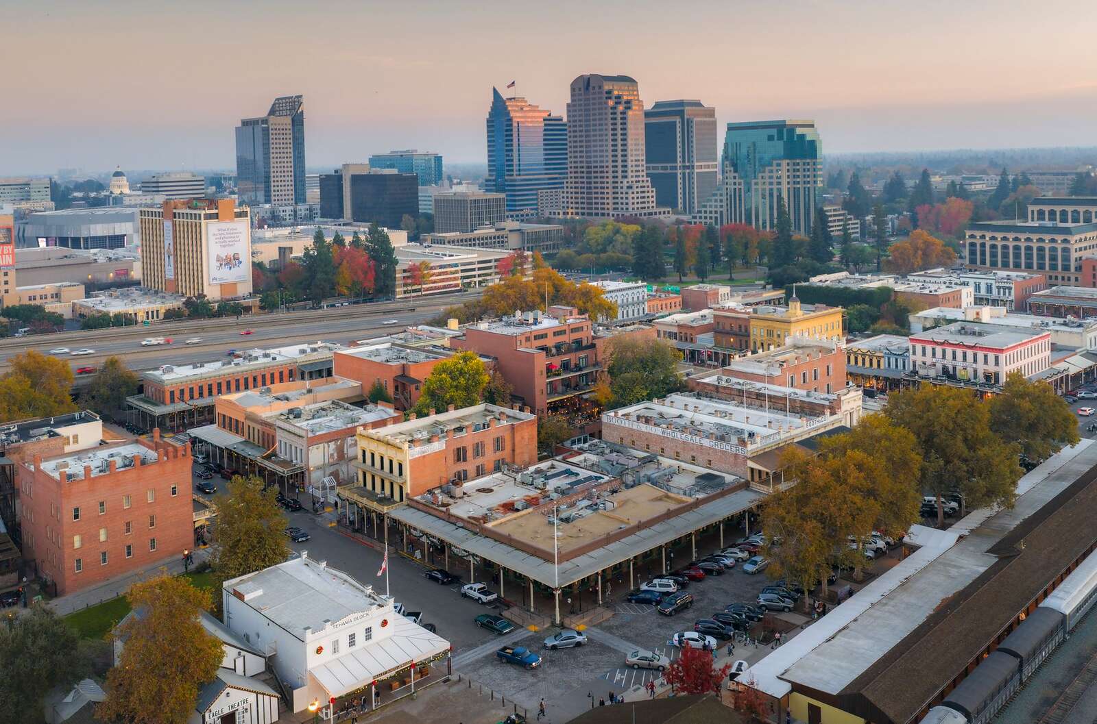 Downtown Sacramento from the air at sunset, with the street grid running to the river
