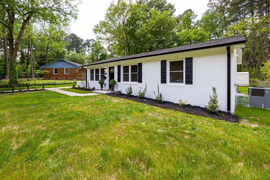 A single-story Orangevale house with a wide front lawn