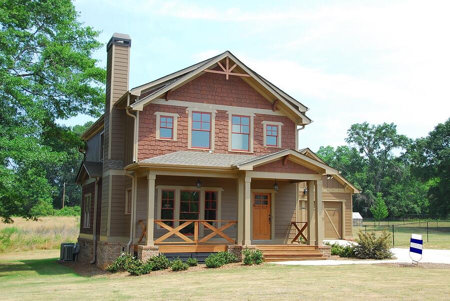 A two-story Craftsman house in Midtown with a full-width porch